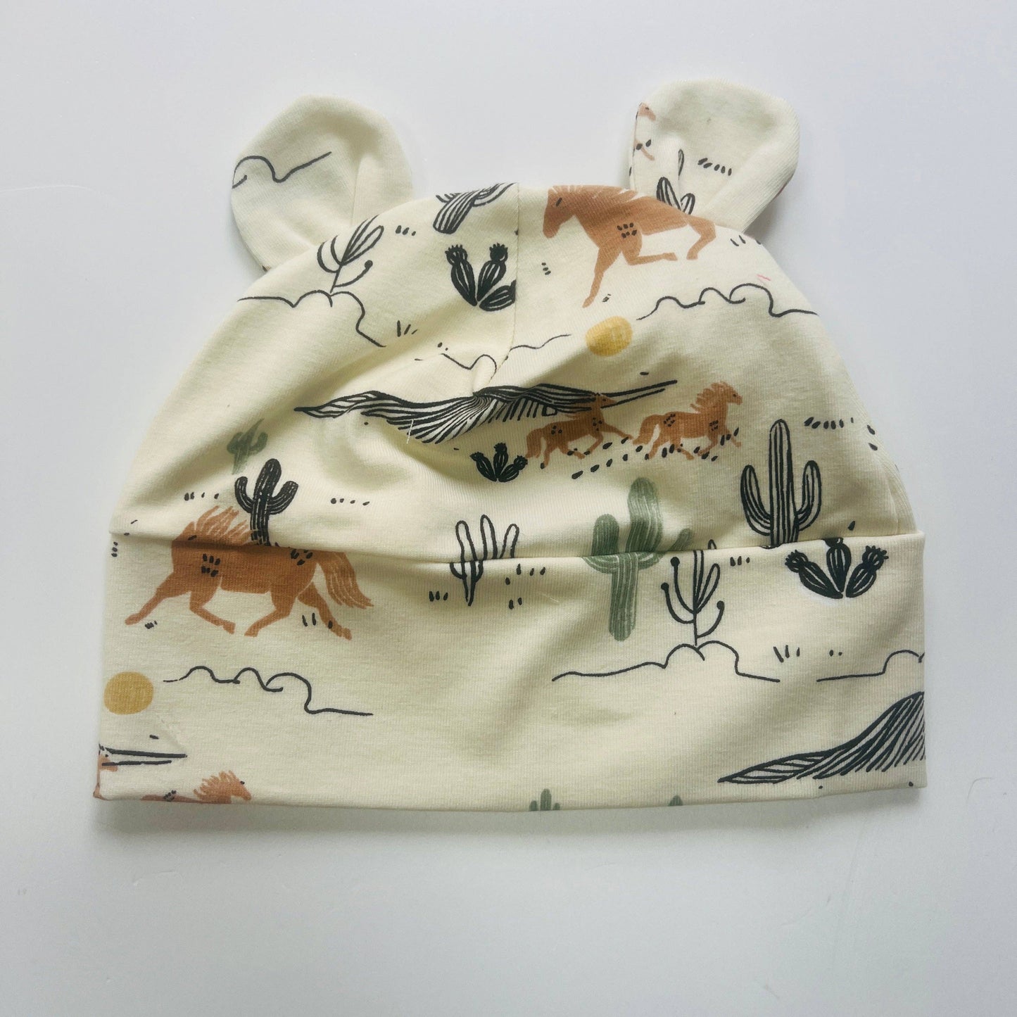 Eddie & Bee organic cotton Baby hat with ears in Cream " Wild West" print.