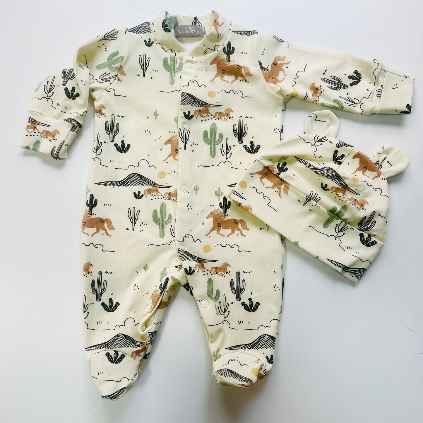 Eddie & Bee organic cotton Baby sleepsuit  in Cream " Wild West " print.