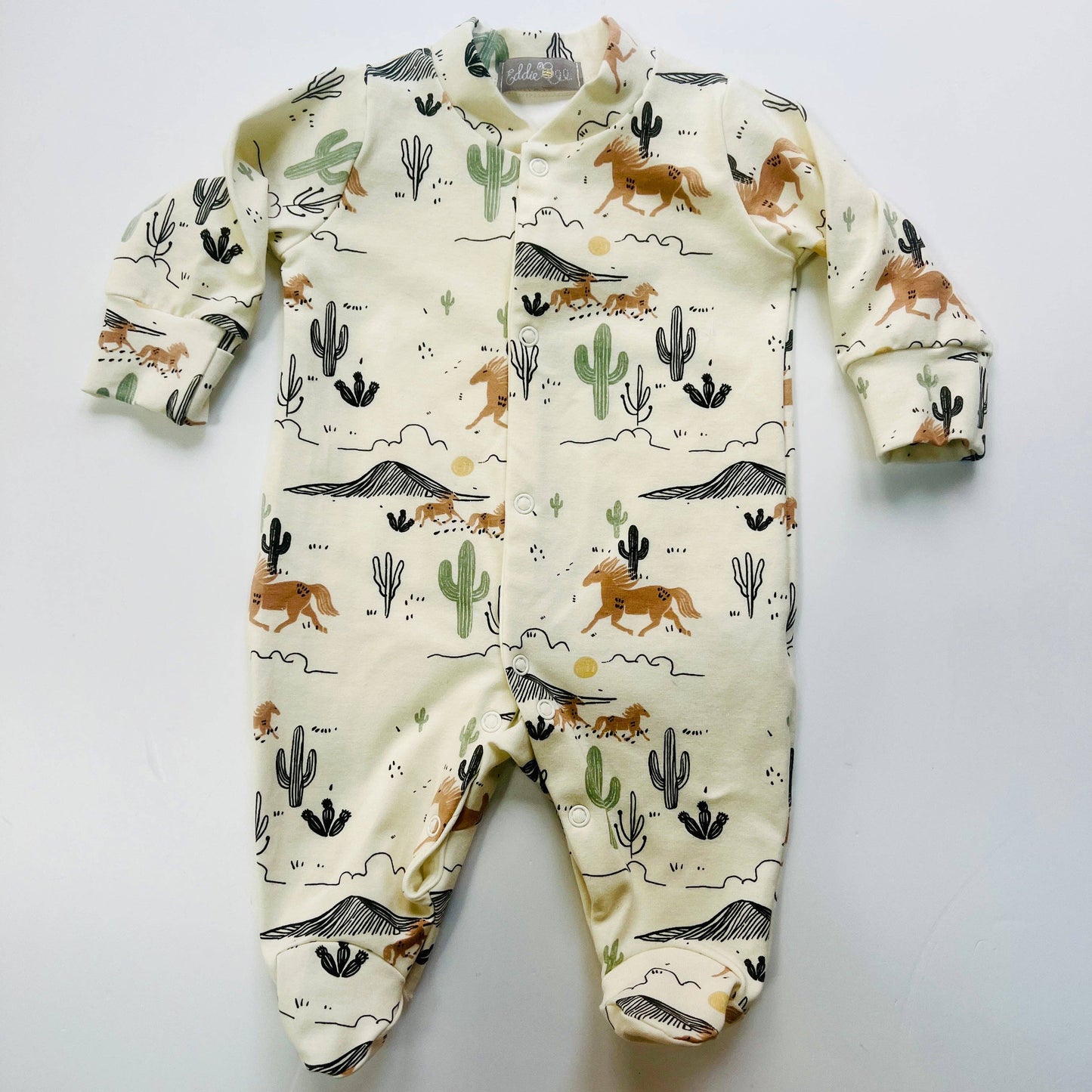 Eddie & Bee organic cotton Baby sleepsuit  in Cream " Wild West " print.